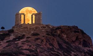 Full moon behind Temple of Poseidon, Sounio Greece. By Constantine Emmanouilidi