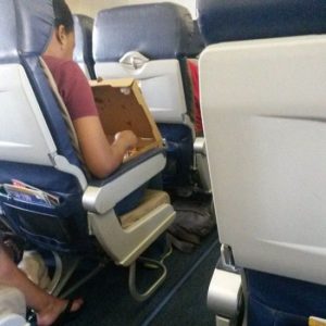 pizza airplane seat eating manners